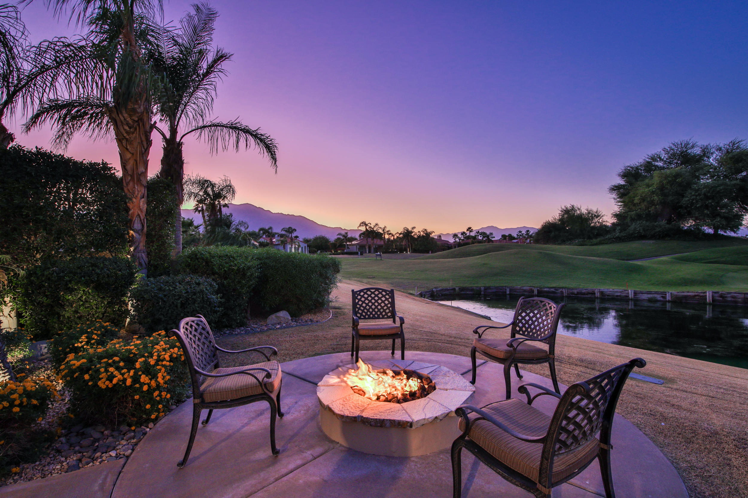 360 Loch Lomond Road Rancho Mirage, CA 92270 - Photo 63 of 76 a backyard of a house with table and chairs