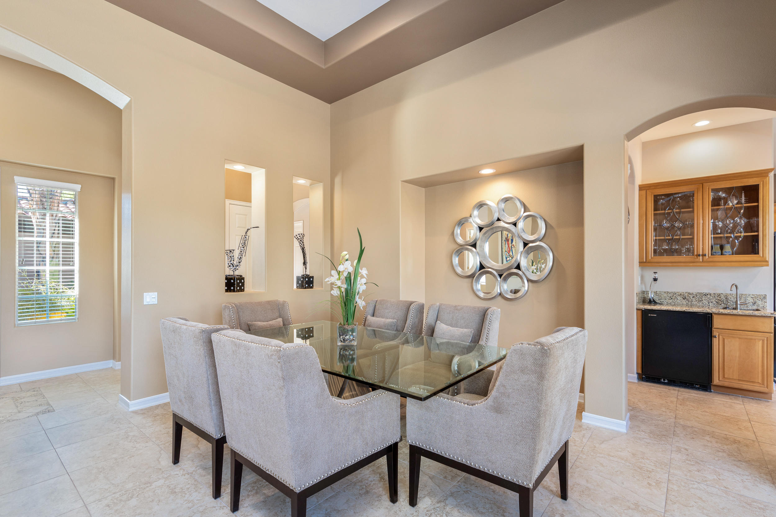 360 Loch Lomond Road Rancho Mirage, CA 92270 - Photo 8 of 76 a view of a dining room with furniture and chandelier