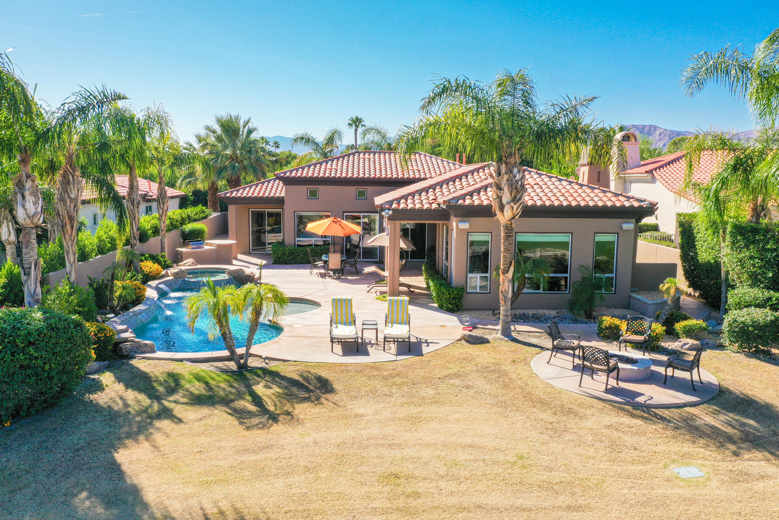 360 Loch Lomond Road Rancho Mirage, CA 92270 - Photo 74 of 76 a view of a house with swimming pool and sitting area