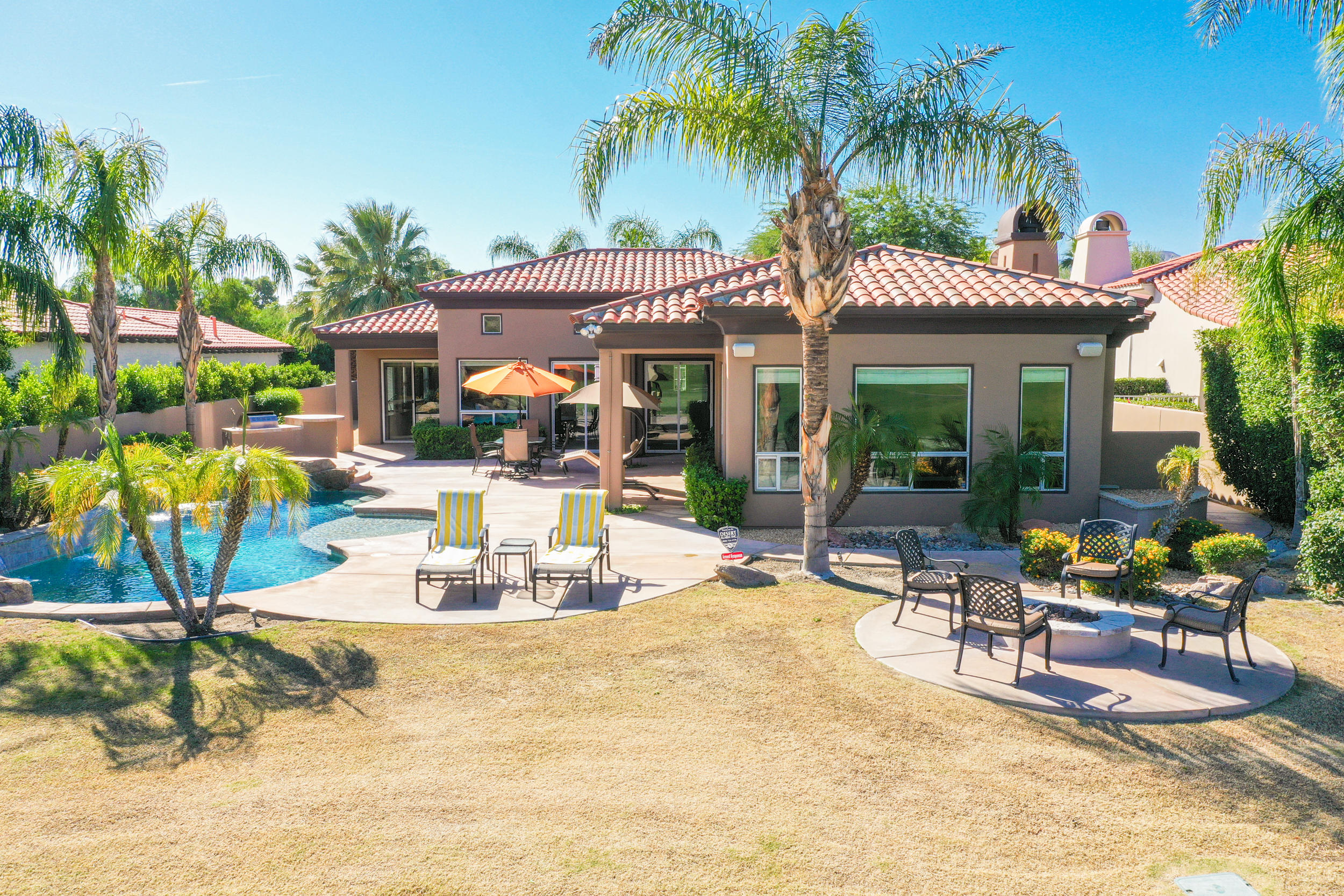 360 Loch Lomond Road Rancho Mirage, CA 92270 - Photo 75 of 76 a view of a swimming pool with chairs