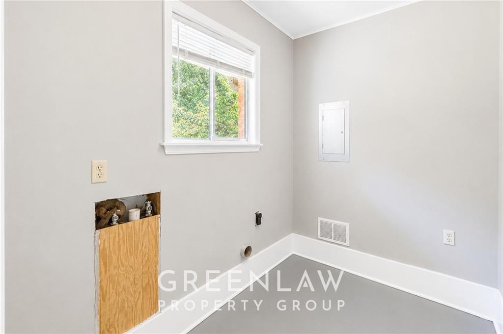 3605 Flat Shoals Road Atlanta, GA 30349 - Photo 19 of 35 a view of a bedroom with wooden floor and a window