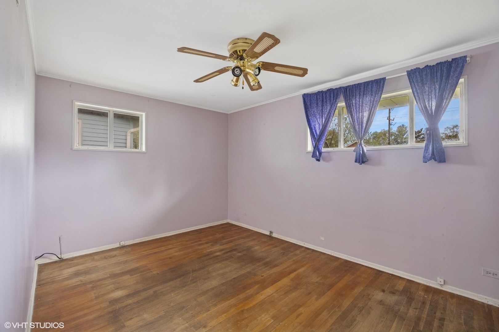 1425 North Wilke Road Arlington Heights, IL 60004 - Photo 6 of 12 a view of room with window and ceiling fan