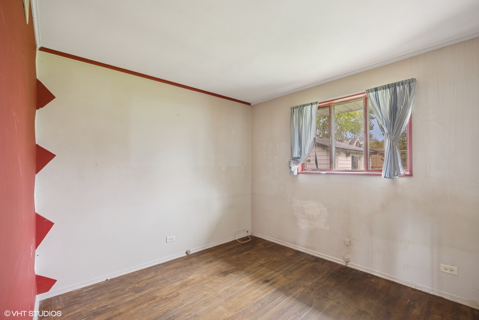 1425 North Wilke Road Arlington Heights, IL 60004 - Photo 8 of 12 a view of an empty room with wooden floor and a window