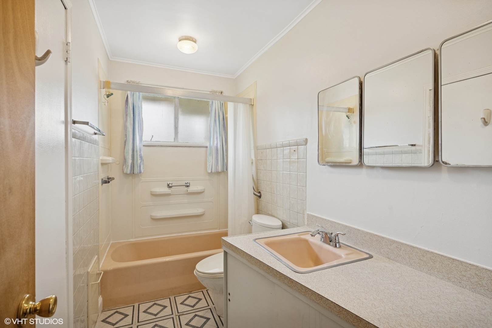 1425 North Wilke Road Arlington Heights, IL 60004 - Photo 9 of 12 a bathroom with a sink a toilet and shower