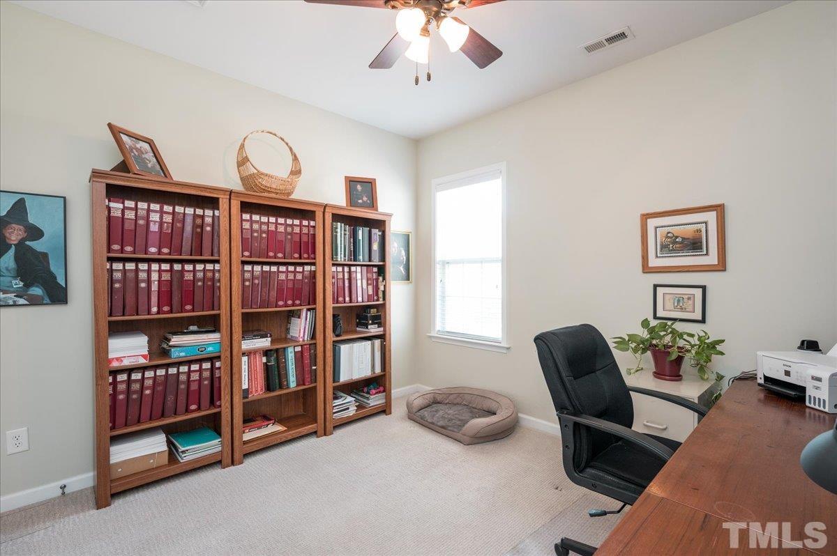 3900 Joe And Ruth Lee Drive Raleigh, NC 27610 - Photo 20 of 25 a view of a livingroom with workspace and a window