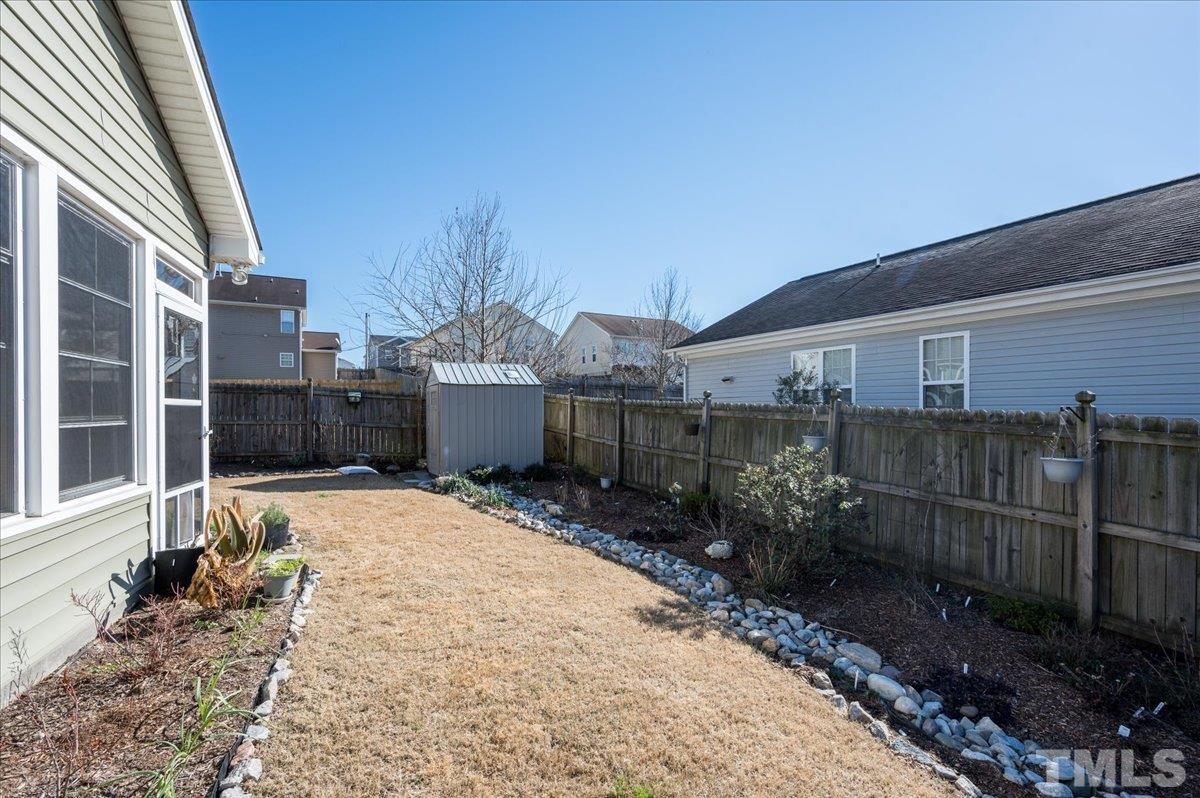 3900 Joe And Ruth Lee Drive Raleigh, NC 27610 - Photo 23 of 25 a wooden house with outdoor space