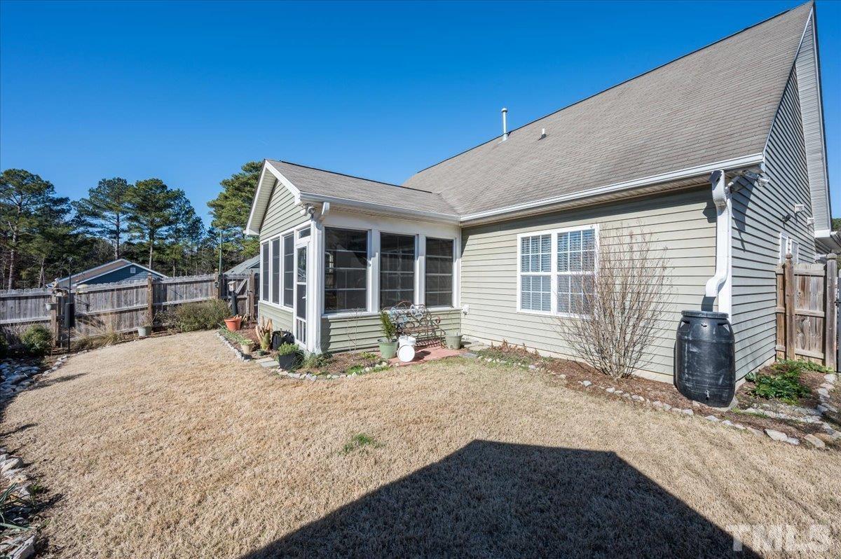3900 Joe And Ruth Lee Drive Raleigh, NC 27610 - Photo 24 of 25 a front view of a house with a garden