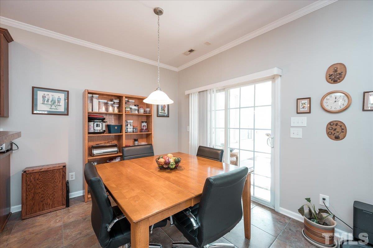 3900 Joe And Ruth Lee Drive Raleigh, NC 27610 - Photo 9 of 25 a view of a dining room with furniture and window