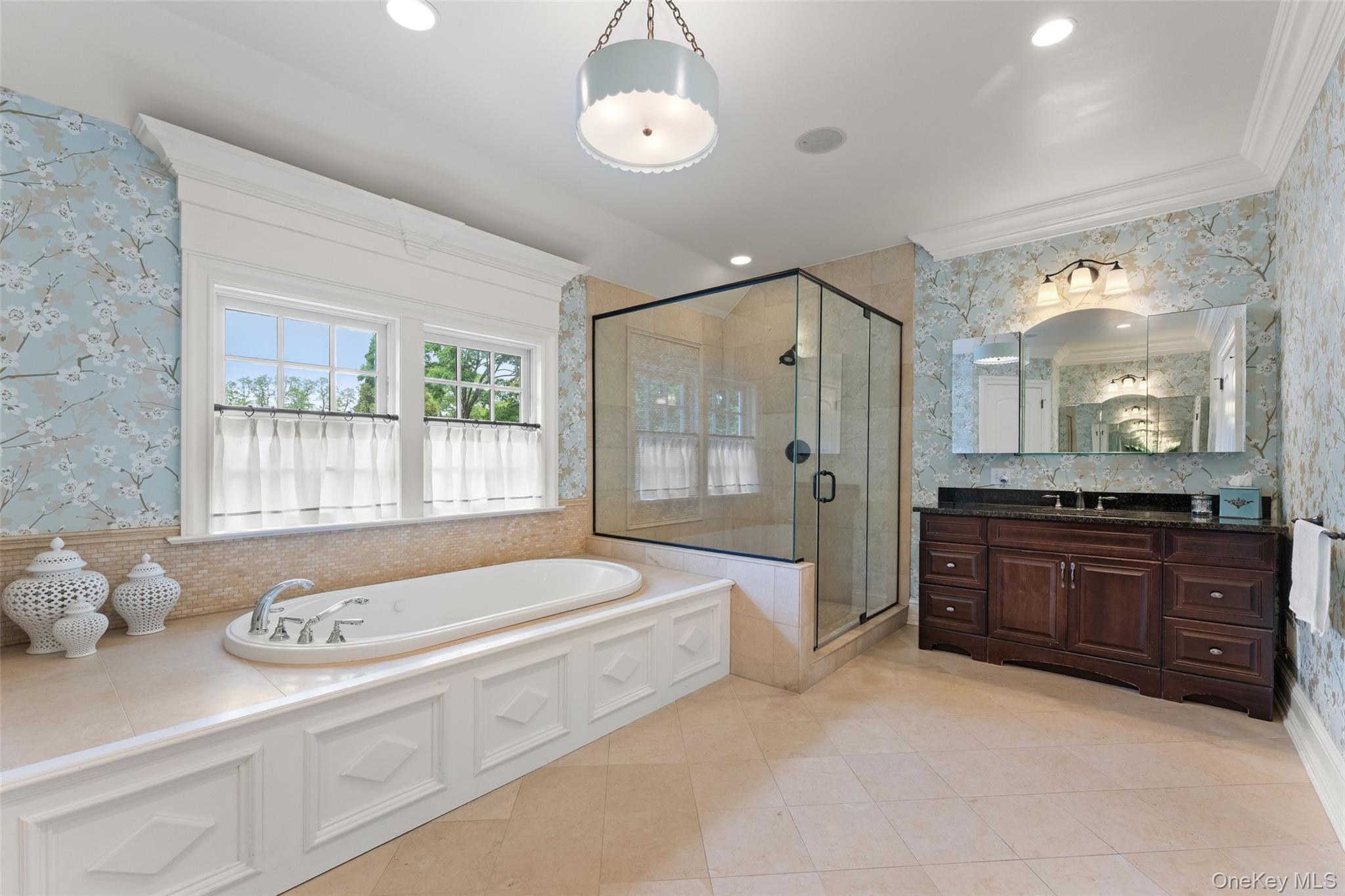 64 Stratton Road Scarsdale, NY 10583 - Photo 20 of 49 Primary bathroom with jacuzzi tub, stall shower and 2 vanities