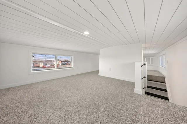 a view of room with stairs and white walls