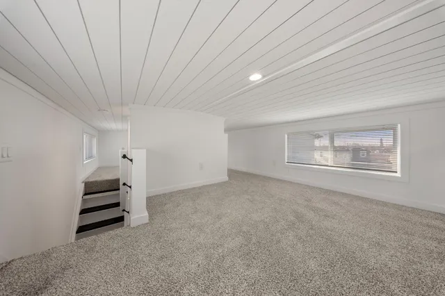 a view of an empty room with stairs