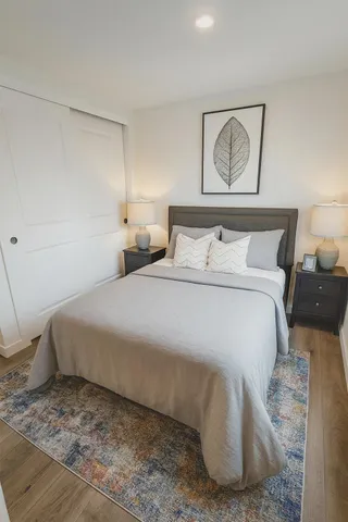 a bedroom with a bed and night stand