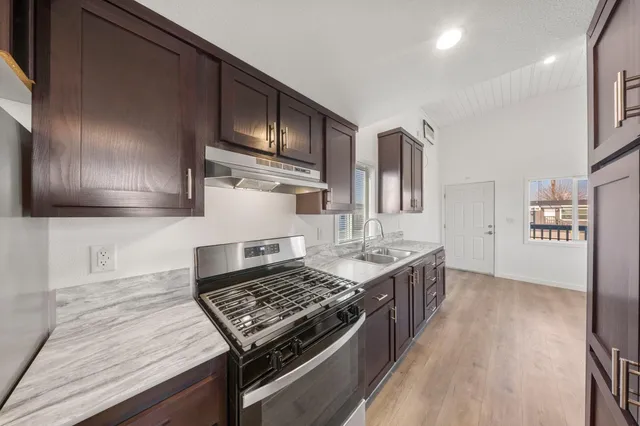 a kitchen with a stove and a sink