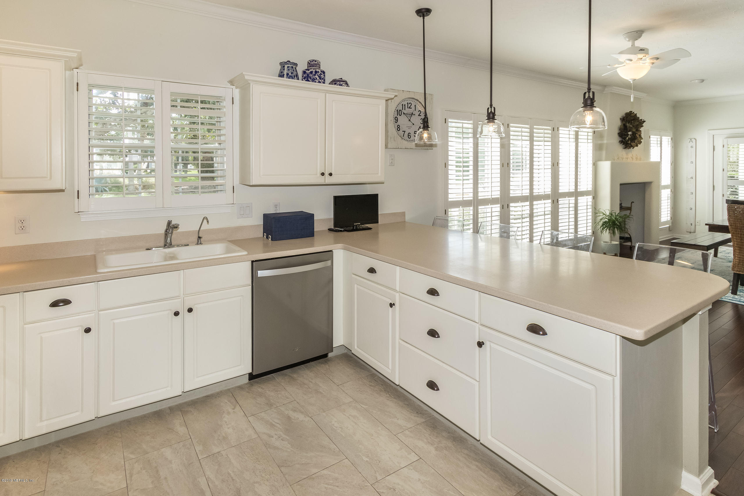 601 Teeside Court St. Augustine, FL 32080 - Photo 11 of 38 a kitchen with cabinets appliances a sink and a window