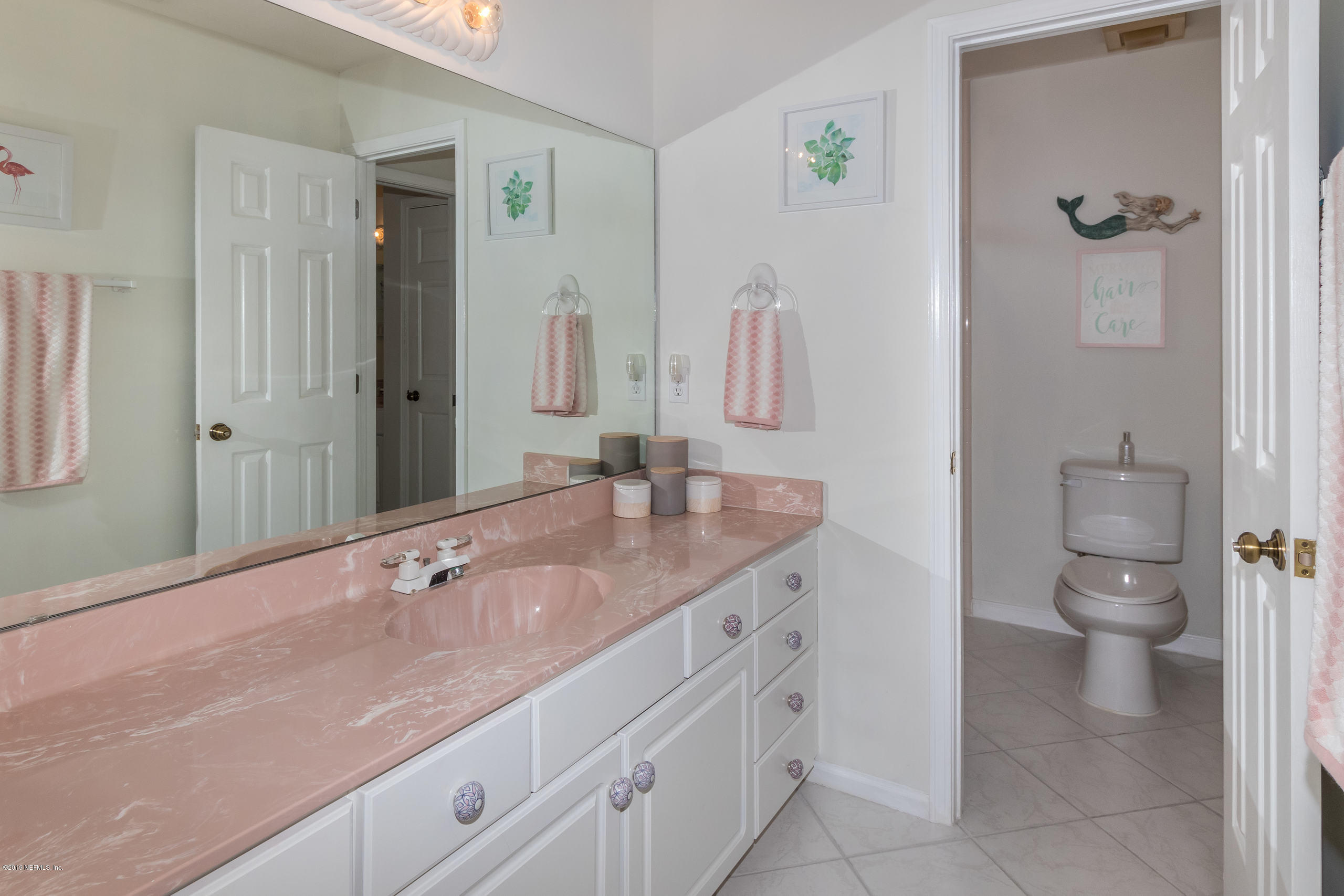 601 Teeside Court St. Augustine, FL 32080 - Photo 22 of 38 a bathroom with a granite countertop sink a toilet and a shower