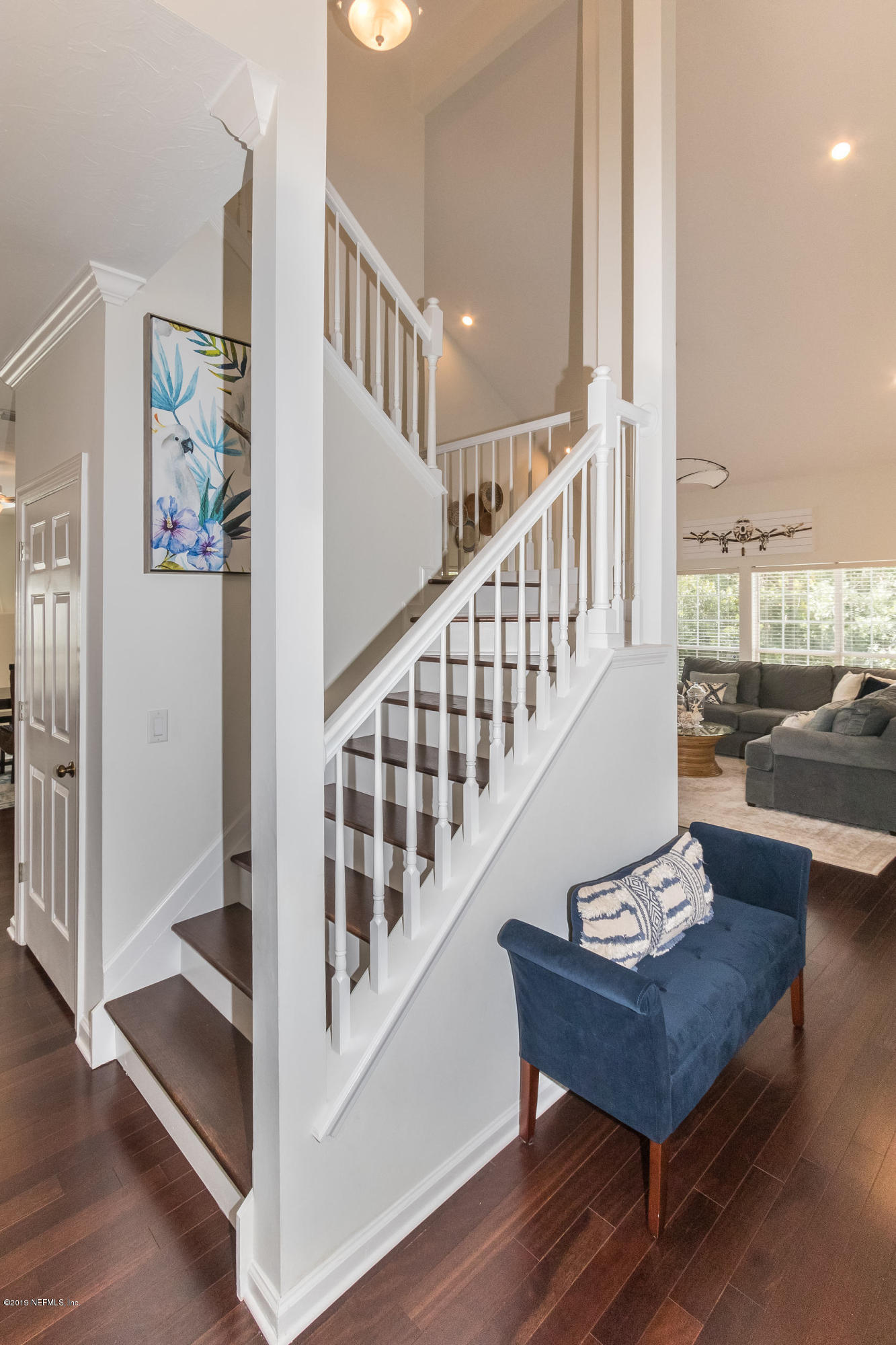 601 Teeside Court St. Augustine, FL 32080 - Photo 26 of 38 a view of staircase with lots of frames on wall and a dining table
