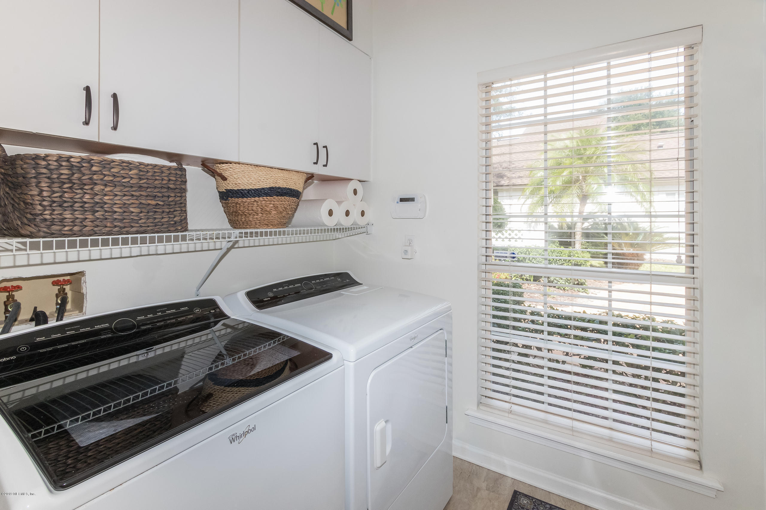601 Teeside Court St. Augustine, FL 32080 - Photo 27 of 38 a kitchen with a stove and white cabinet