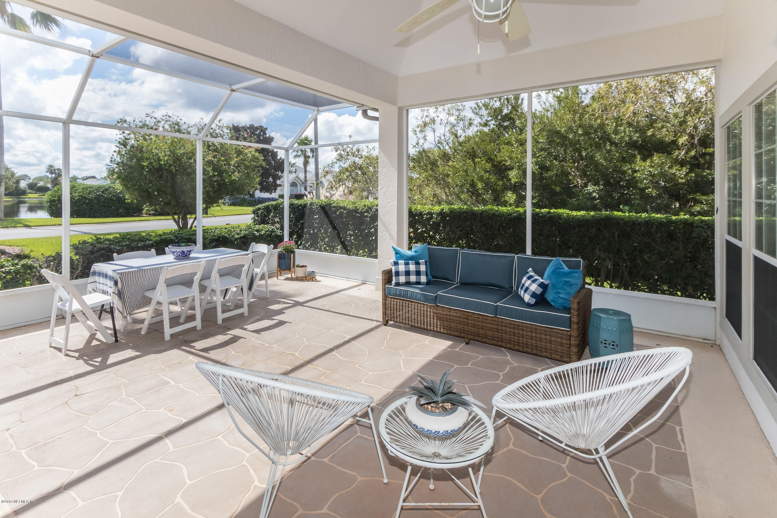 601 Teeside Court St. Augustine, FL 32080 - Photo 28 of 38 a view of a patio with couches potted plants and a big yard