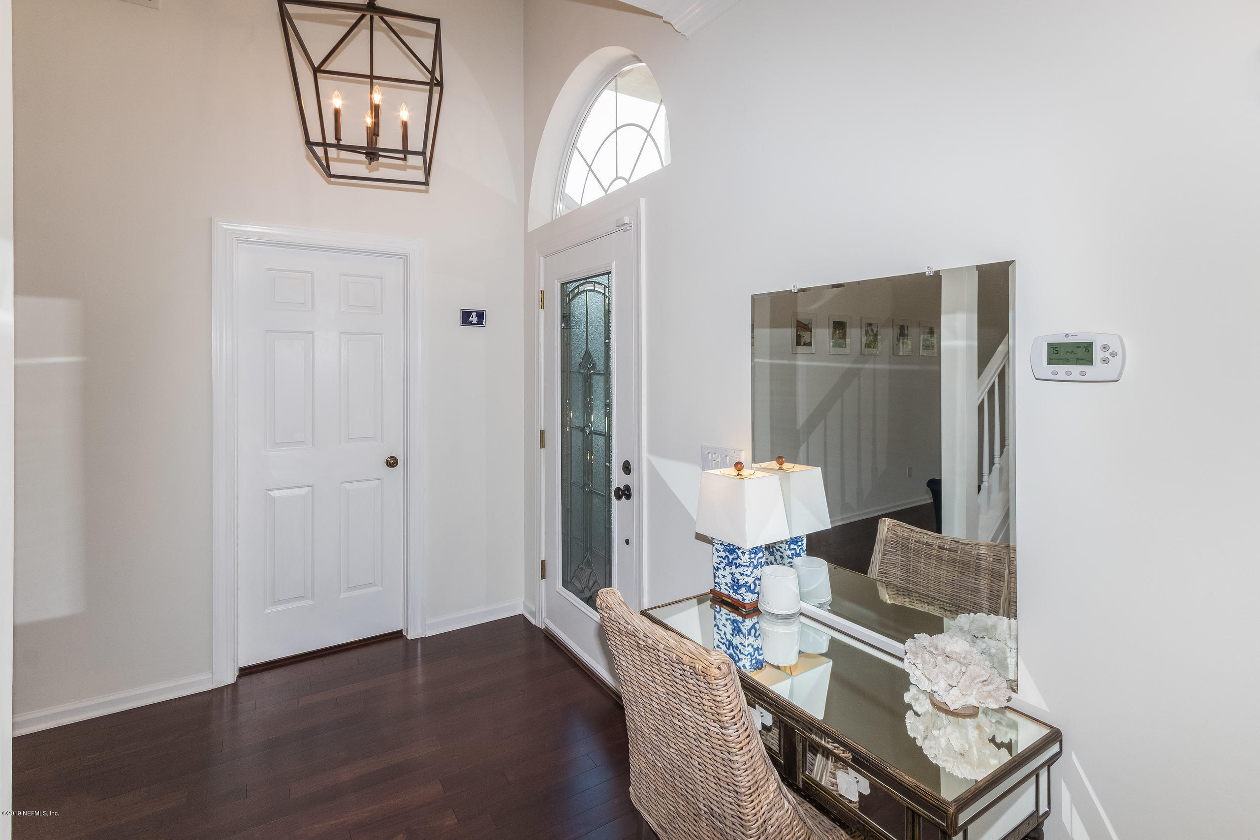 601 Teeside Court St. Augustine, FL 32080 - Photo 5 of 38 a living room with furniture and a chandelier