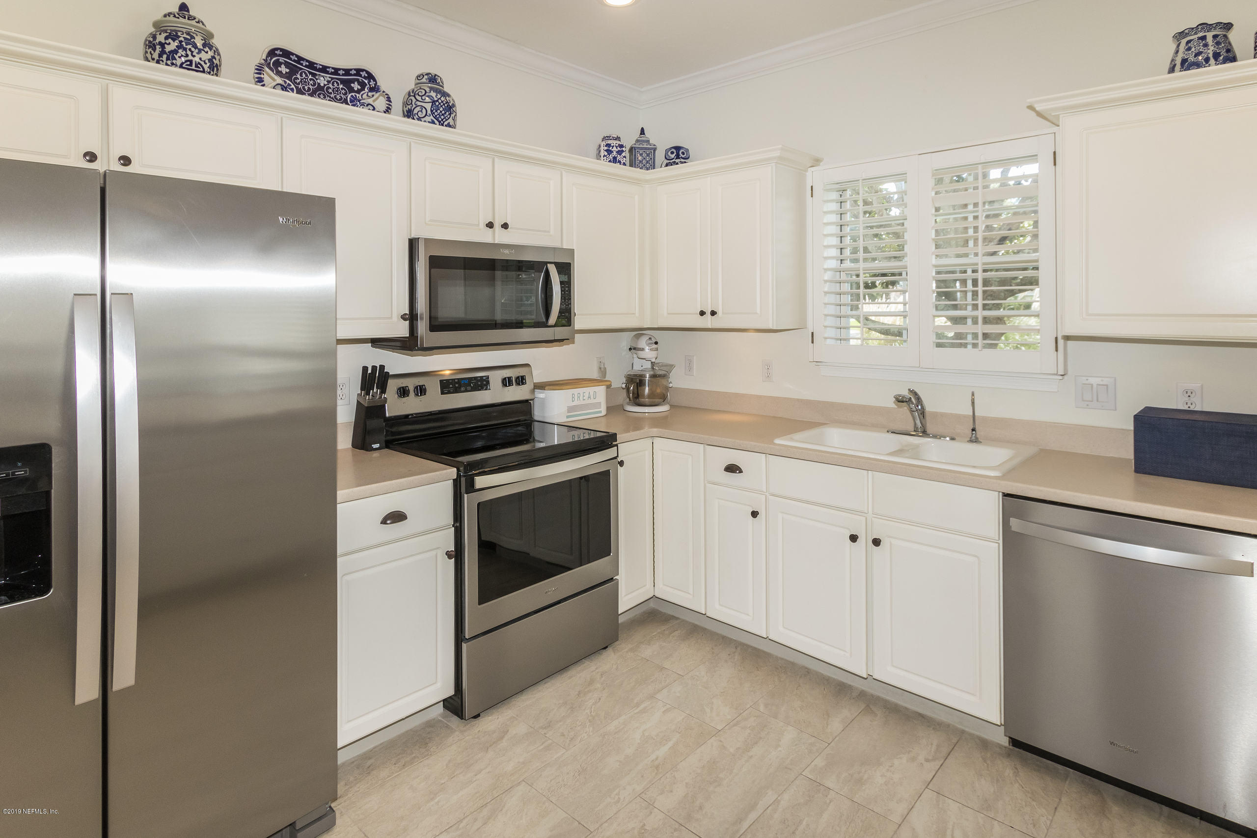 601 Teeside Court St. Augustine, FL 32080 - Photo 10 of 38 a kitchen with a sink stove and refrigerator