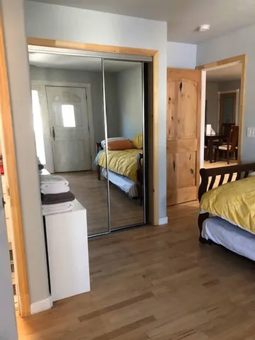 a bathroom with a toilet and a mirror