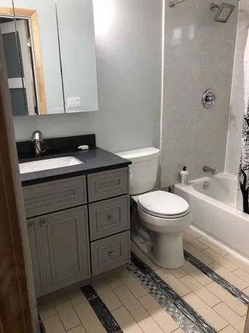 a living room with a couch and a flat screen tv