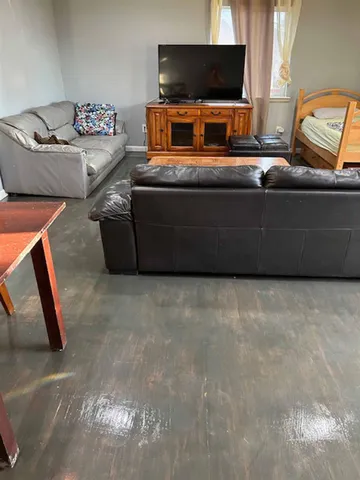 a bedroom with bed and window