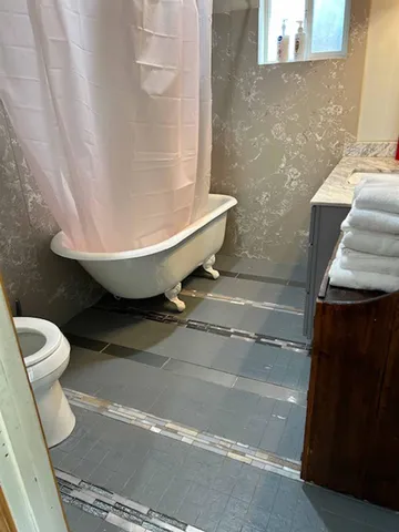 a bathroom with a sink and toilet