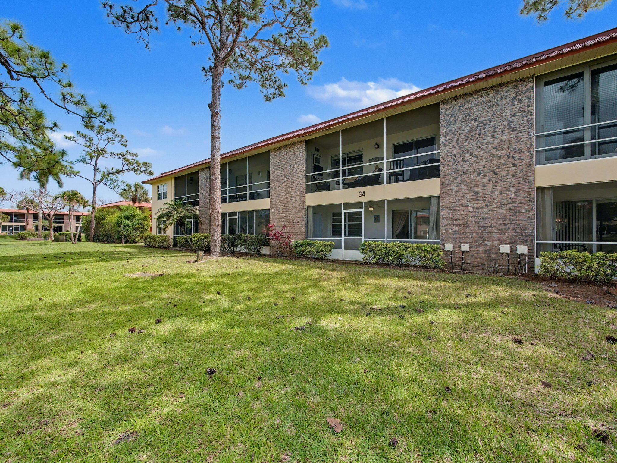 1967 Southwest Palm City Road, Unit 34C Stuart, FL 34994 - Photo 17 of 25 a front view of a house with a yard