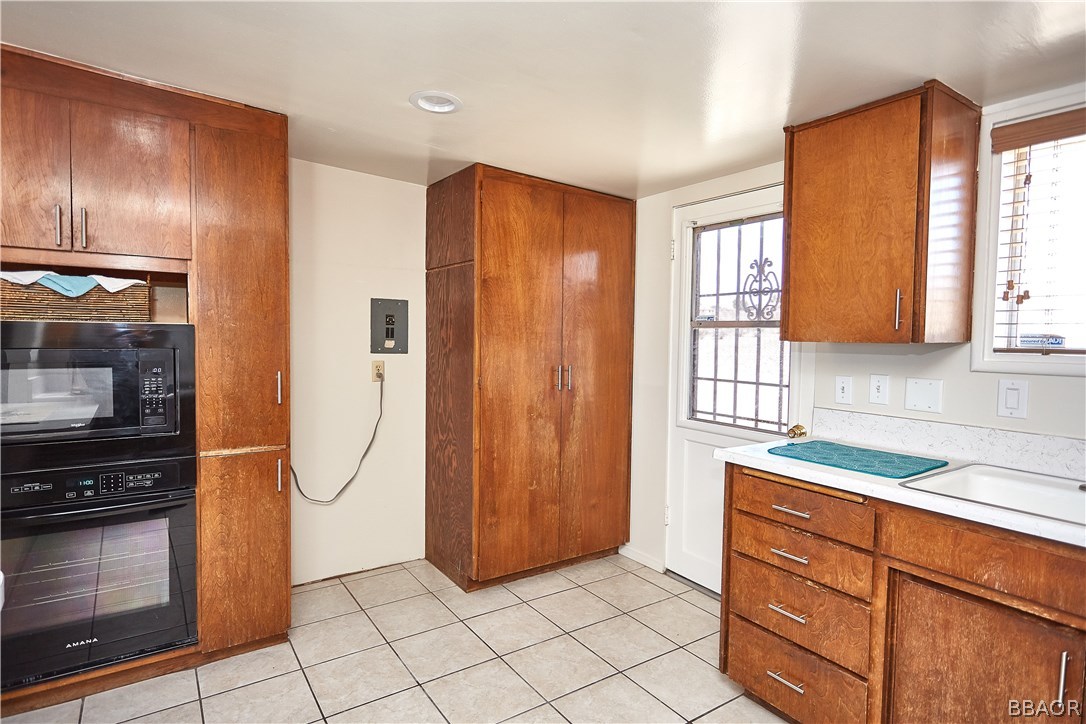 19616 Huasna Road Apple Valley, CA 92307 - Photo 13 of 48 a kitchen with stainless steel appliances granite countertop a refrigerator and a sink
