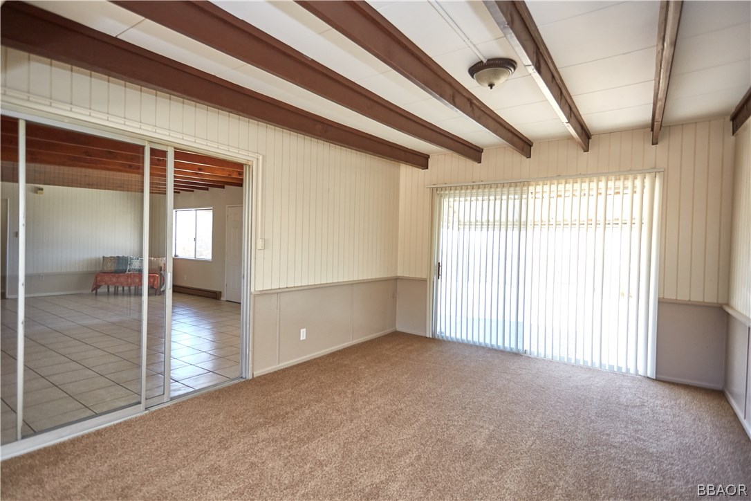 19616 Huasna Road Apple Valley, CA 92307 - Photo 21 of 48 a view of empty room with wooden floor