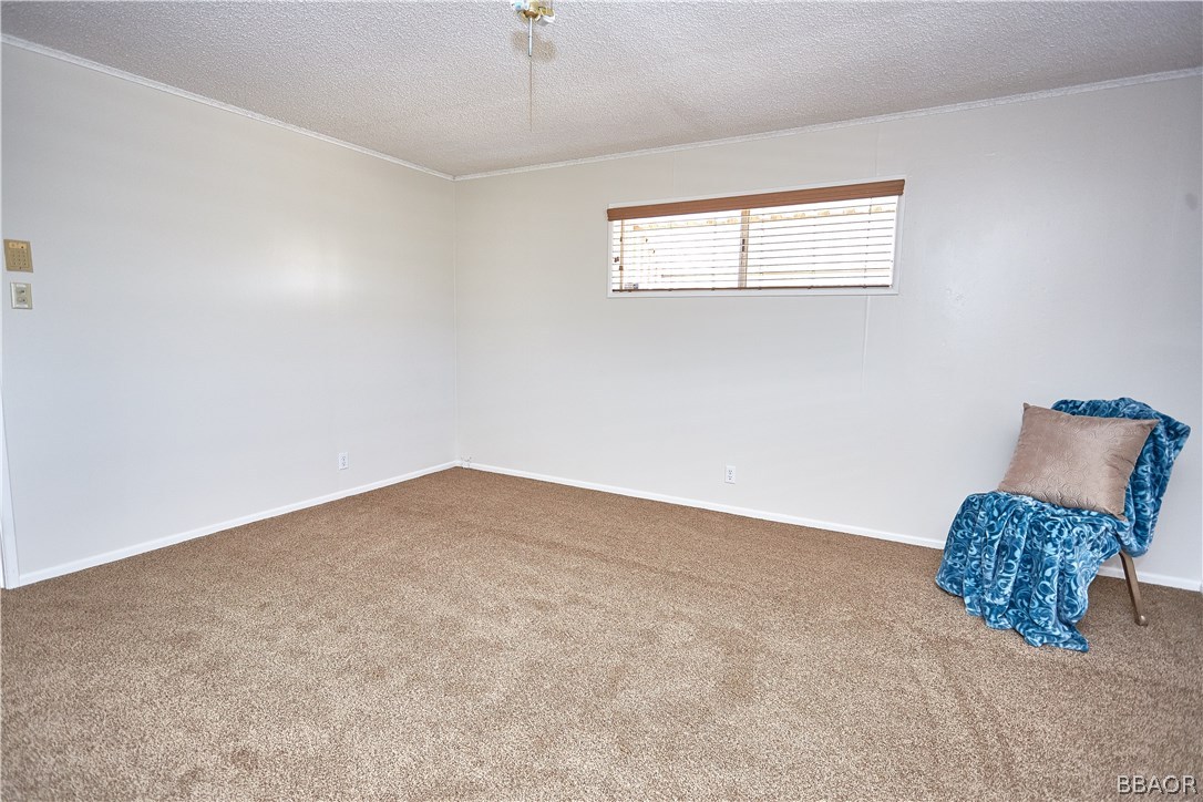 19616 Huasna Road Apple Valley, CA 92307 - Photo 23 of 48 an empty room with windows and closet
