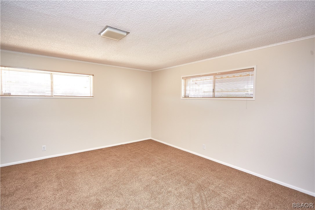 19616 Huasna Road Apple Valley, CA 92307 - Photo 25 of 48 an empty room with windows