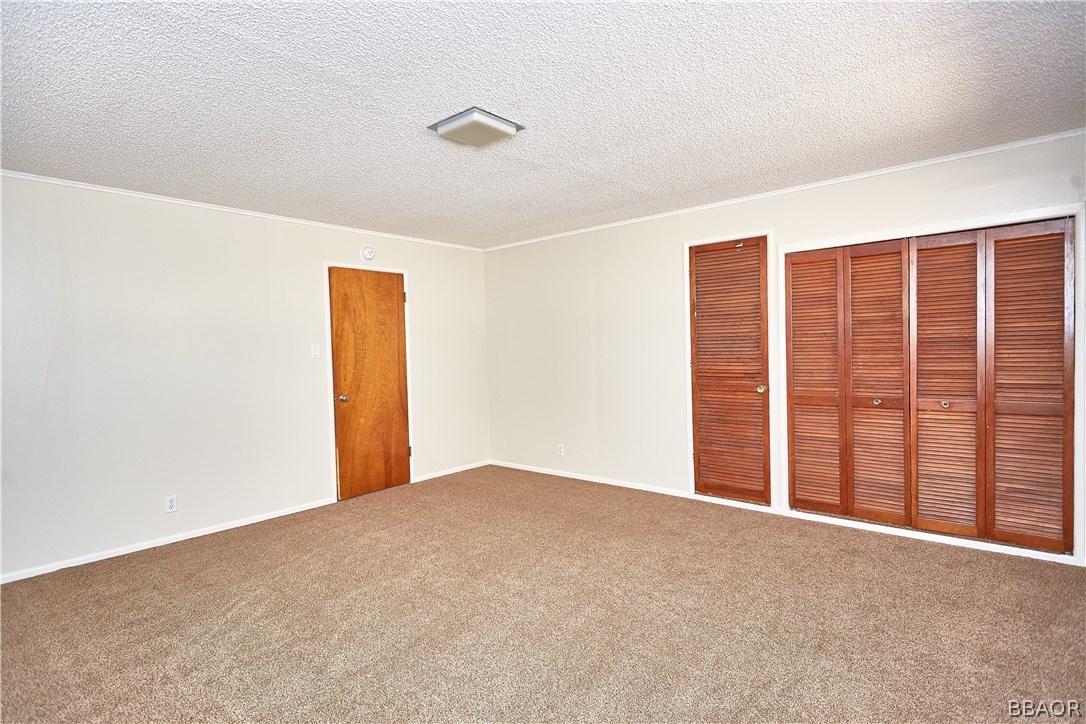 19616 Huasna Road Apple Valley, CA 92307 - Photo 27 of 48 a view of an empty room with a window