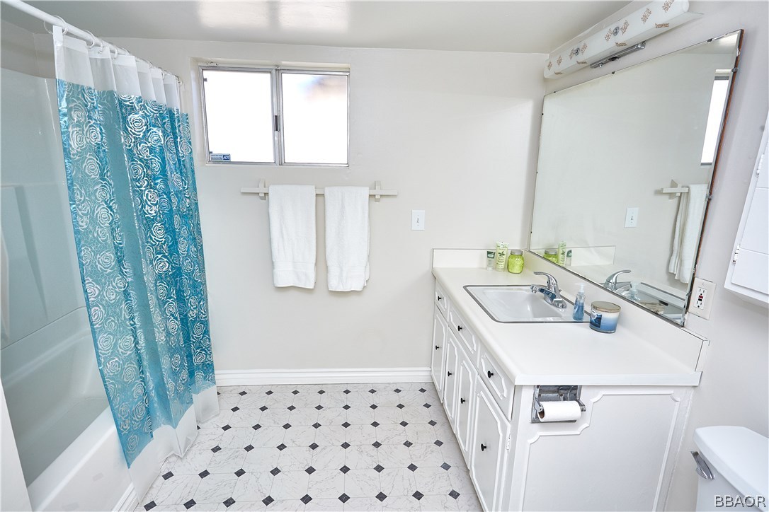 19616 Huasna Road Apple Valley, CA 92307 - Photo 31 of 48 a bathroom with a sink and a mirror