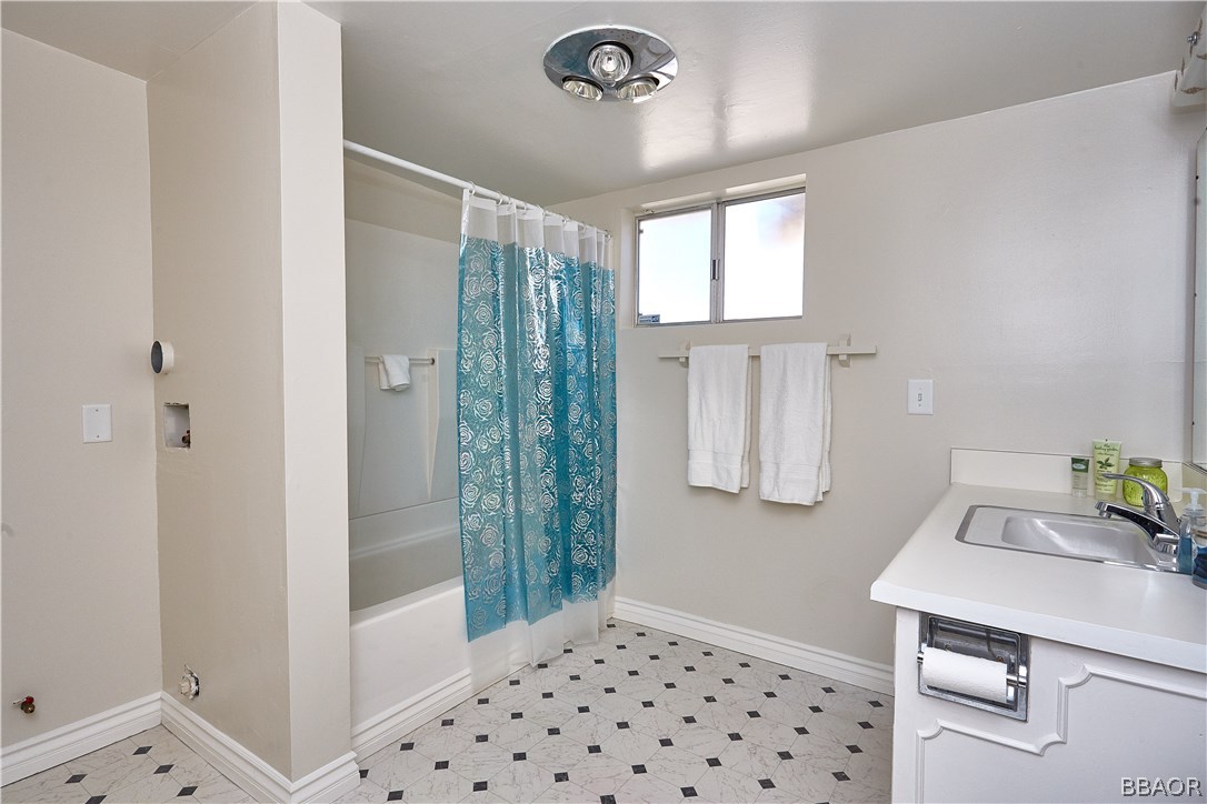 19616 Huasna Road Apple Valley, CA 92307 - Photo 33 of 48 a bedroom with a bed and a window