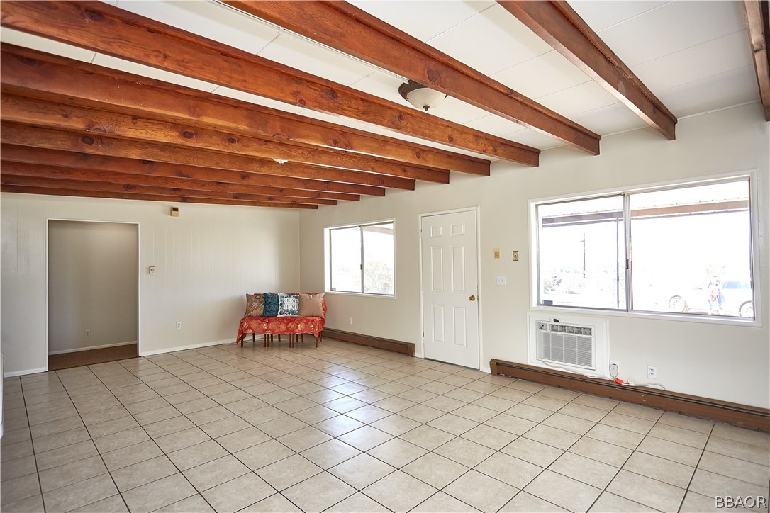 19616 Huasna Road Apple Valley, CA 92307 - Photo 5 of 48 a view of an empty room with window