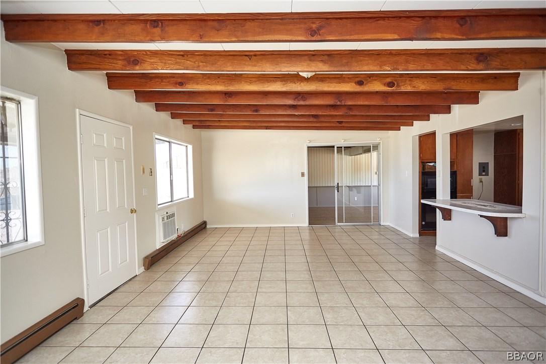 19616 Huasna Road Apple Valley, CA 92307 - Photo 7 of 48 a view of an empty room and window