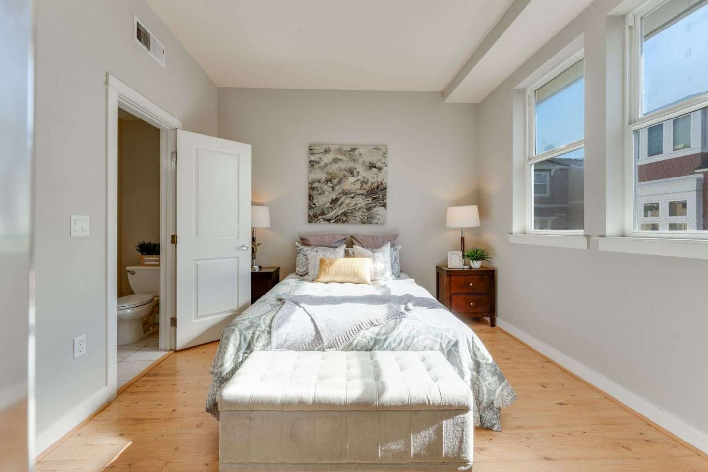 885 Frederick Commons San Jose, CA 95126 - Photo 12 of 30 a bed sitting in a bedroom next to a bathroom