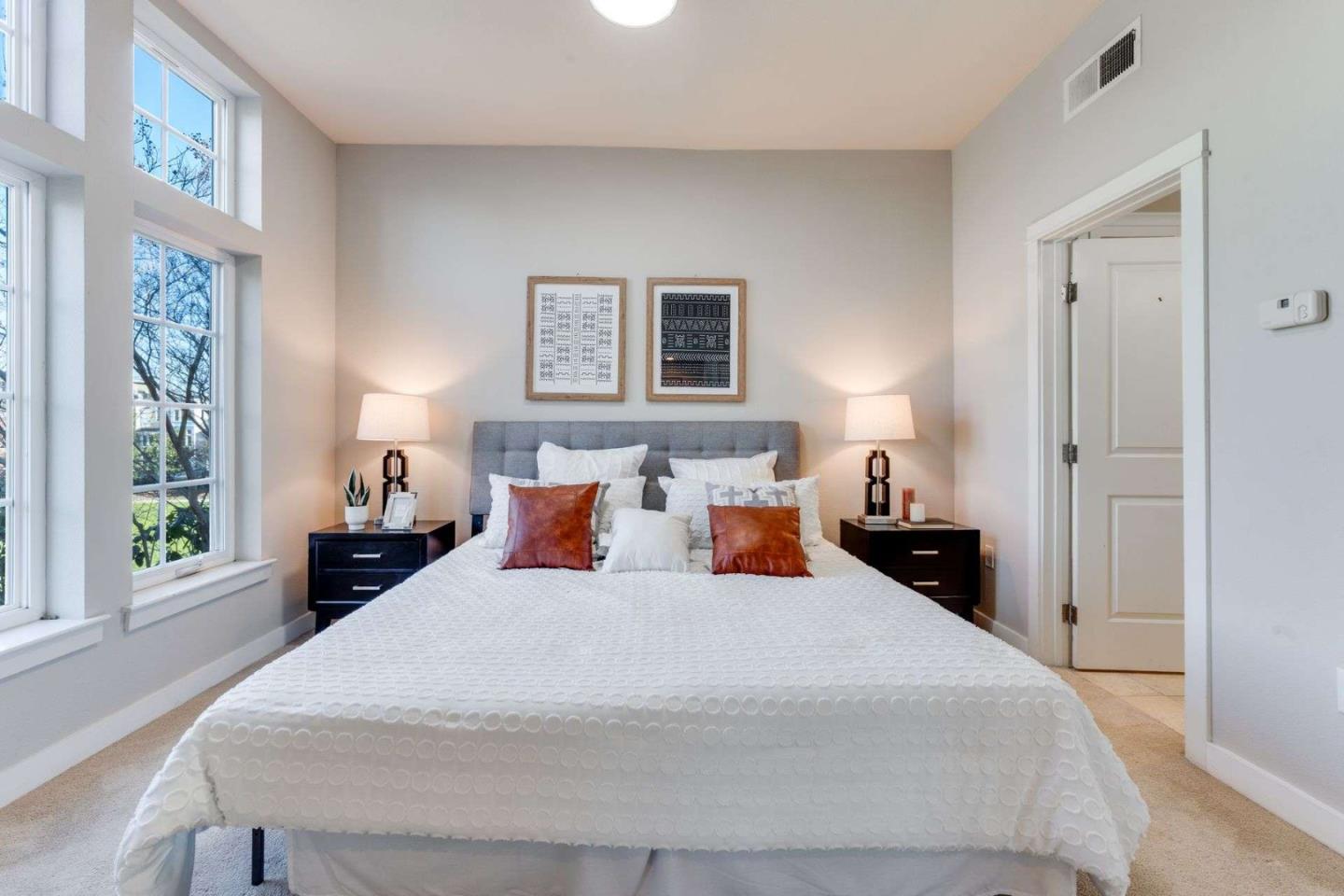 885 Frederick Commons San Jose, CA 95126 - Photo 16 of 30 a bed sitting in a bedroom next to a window