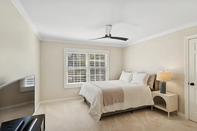 a bedroom with a bed and a night stand