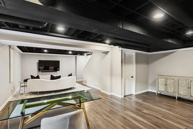 a room with wooden floor and furniture