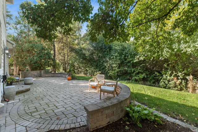 a view of a backyard with sitting area