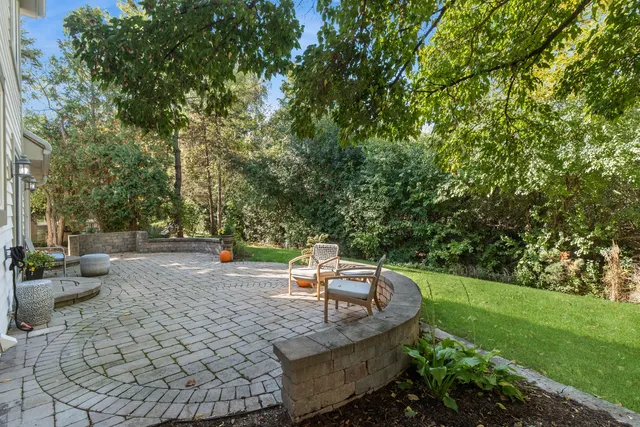 a view of a backyard with sitting area