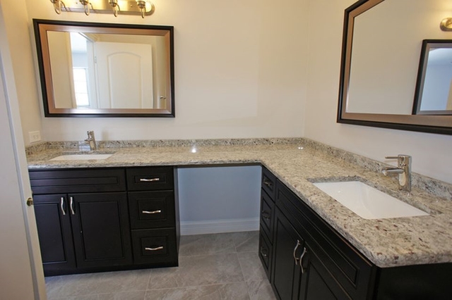 126 North Oltendorf Road Streamwood, IL 60107 - Photo 11 of 16 a bathroom with a granite countertop sink and a mirror