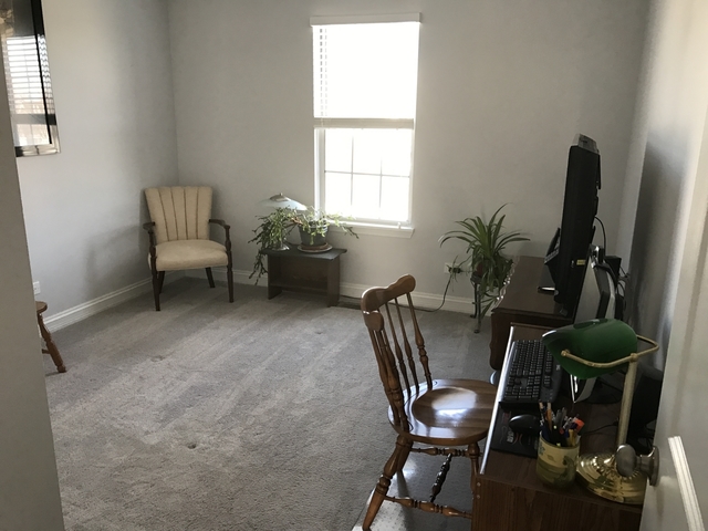 126 North Oltendorf Road Streamwood, IL 60107 - Photo 12 of 16 a view of a workspace with furniture and a window