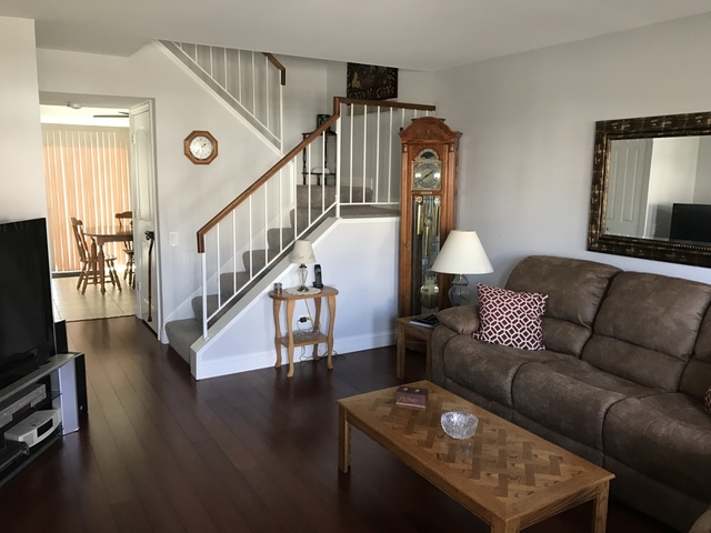 126 North Oltendorf Road Streamwood, IL 60107 - Photo 4 of 16 a living room with furniture and a flat screen tv