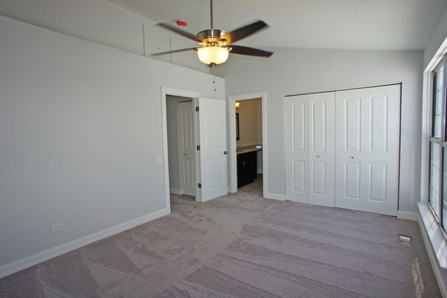 126 North Oltendorf Road Streamwood, IL 60107 - Photo 10 of 16 an empty room with closet and a ceiling fan