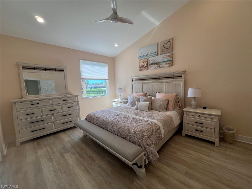 6809 Ascot Drive, Unit 201 Naples, FL 34113 - Photo 16 of 37 a spacious bedroom with a bed and a dresser