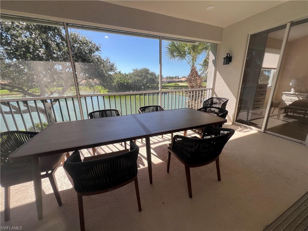 6809 Ascot Drive, Unit 201 Naples, FL 34113 - Photo 2 of 37 a view of a balcony dining area